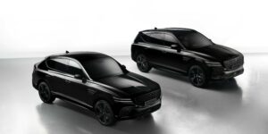 Sleek black Genesis GV80 SUVs showcased in a professional studio setting, emphasizing luxury and design.